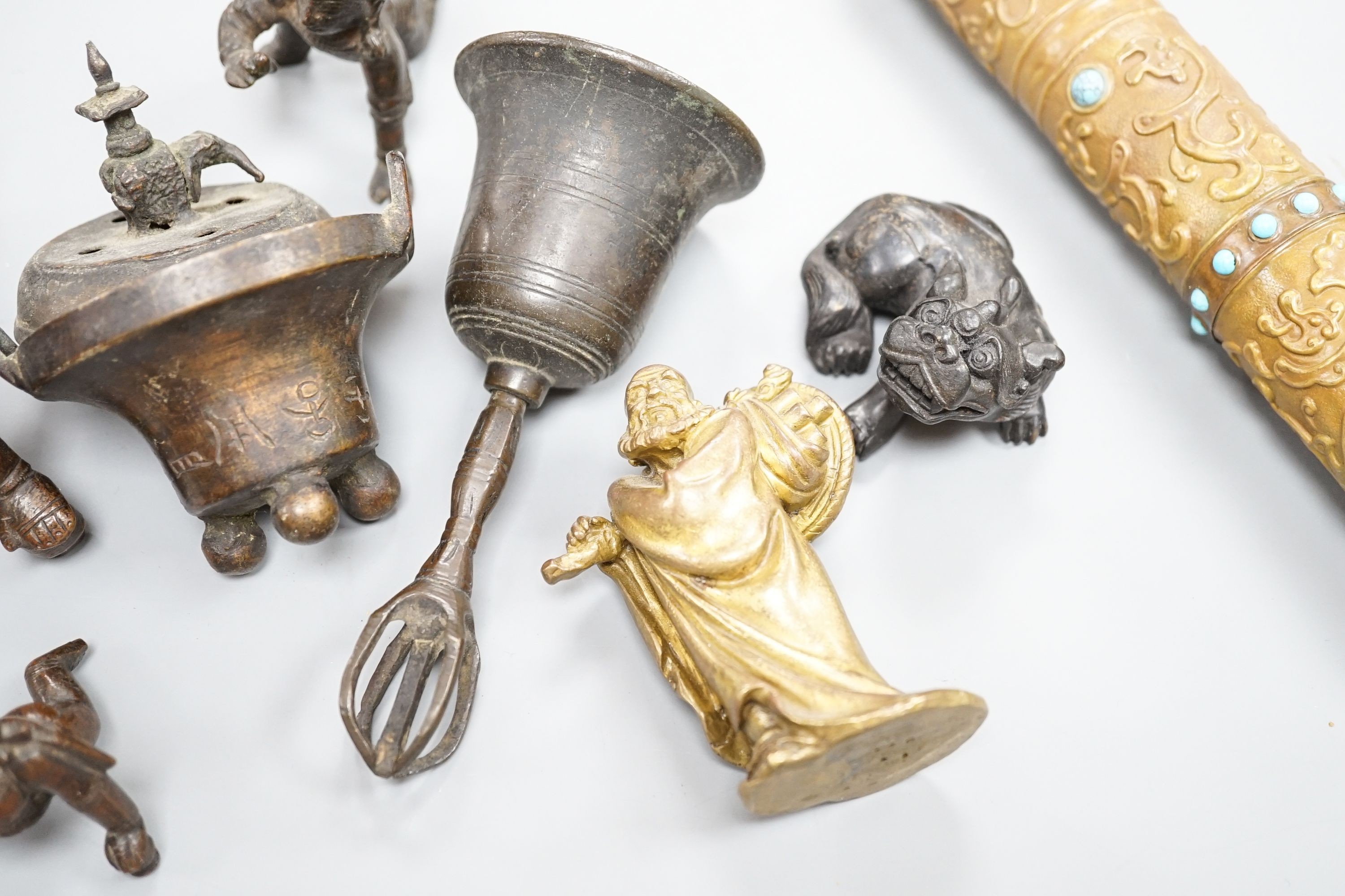 A Chinese gilt copper figure, a Chinese Dog of Fo, a bell, a censer, six Indian bronze figures and a scroll box